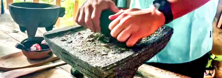 Grinding ingredients on a metate